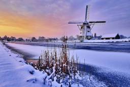 Dutch windmill in the snow of a holland winter